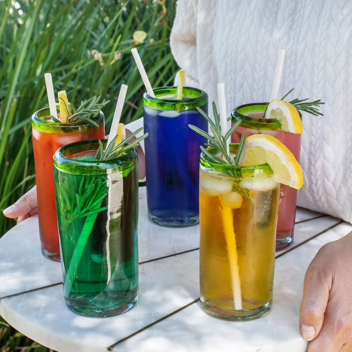 Bamboo straws served in colorful cold drinks with lemon
