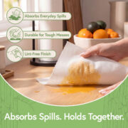Durable absorbent reusable towel cleaning a spill on a kitchen counter